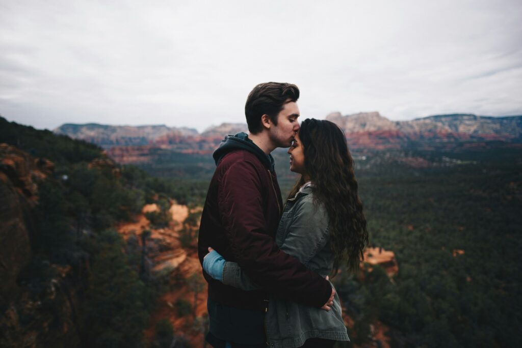 Gentle Forehead Kiss - creative couple pose idea for photoshoot